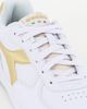 Immagine di DIADORA RAPTOR LOW METALIC SATIN WN - Sneakers bianca con dettagli oro e lacci