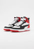 Immagine di PUMA REBOUND JOY JR - Sneakers alta bianca e nera con dettagli rossi e lacci, numerata 36/39