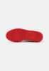 Immagine di PUMA REBOUND JOY JR - Sneakers alta bianca e nera con dettagli rossi e lacci, numerata 36/39