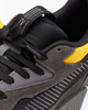 Immagine di PUMA - Sneakers da uomo grigo scuro e nera con dettagli gialli con tomaia in mesh traspirante - RS Z REINVENTION