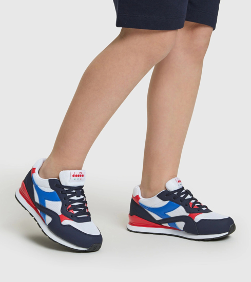 Immagine di PUMA - Sneakers bianca e blu con dettagli rossi, numerata 36/39 - N 92 GS