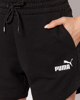 Immagine di PUMA - Pantaloncini corti da donna neri a vita alta con logo bianco