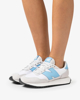 Immagine di NEW BALANCE - Sneakers da donna bianca e argento con logo azzurro - 237