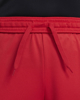 Immagine di NIKE - Pantaloncini corti da bambino rossi in tessuto traspirante con logo bianco e bande laterali nere