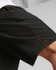 Immagine di PUMA - Pantaloni corti da uomo neri con logo grigio e lacci