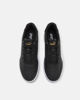 Immagine di PUMA - Sneakers da uomo nera e bianca con dettagli oro - CAVEN 2.0