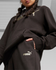 Immagine di PUMA - Pantalone tuta da donna nero con logo color bronzo