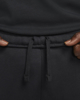 Immagine di NIKE - Pantalone tuta da uomo nero con elastico alla caviglia e logo bianco