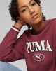 Immagine di PUMA - Felpa da donna relaxed fit bordeaux con logo bianco