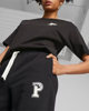 Immagine di PUMA - Pantalone tuta da donna nero con elastico alla caviglie