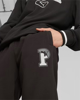 Immagine di PUMA - Pantalone tuta da uomo nero con logo verde bianco