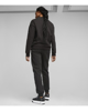 Immagine di PUMA - Pantalone tuta da donna nero con banda logo laterale