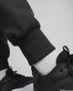 Immagine di PUMA - Pantalone tuta nero da uomo con stampa laterale