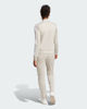Immagine di ADIDAS - TUTA COMPLETA BEIGE E BIANCA TR TS T.U. DA DONNA - JD2686