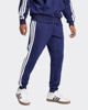 Immagine di ADIDAS - PANTALONI TUTA DA UOMO BLU  ESSENTIALS 3 - STRIPES FELPATI  - JD1859