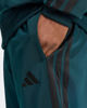 Immagine di ADIDAS -  TUTA UOMO VERDE PETROLIO CON 3 BANDE NERE ESSENTIALS 3-STRIPES -JX5502