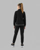 Immagine di PUMA - TUTA COMPLETA NERA DA RAGAZZA FULL ZIP CON LOGO STRASS (7-16 ANNI) 693862-01