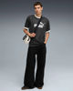 Immagine di PUMA - T-SHIRT NERA A RIGHE BIANCA  ESSENTIAL STRIPED JSY  DA UOMO, 688263-01