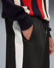 Immagine di PUMA - PANTALONE TUTA 3/4 NERO CON BANDE BIANCHE T7 RELAXED - DA UOMO, 635359-01