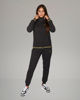 Immagine di PUMA - TUTA COMPLETA NERA ESSENTIAL+ GLITTER FZ SUIT FL  DA DONNA ,  684764-01