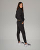 Immagine di PUMA - TUTA COMPLETA NERA ESSENTIAL+ GLITTER FZ SUIT FL  DA DONNA ,  684764-01