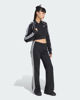 Immagine di ADIDAS -PANTALONE TUTA  A ZAMPA  NERO CON DETTAGLI BIANCHI DA DONNA, KQ6424
